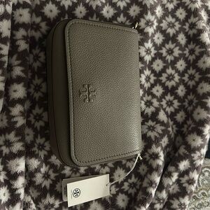 Tory Burch Thea Flap Crossbody 
Style # 144688
Color Gray Heron/082